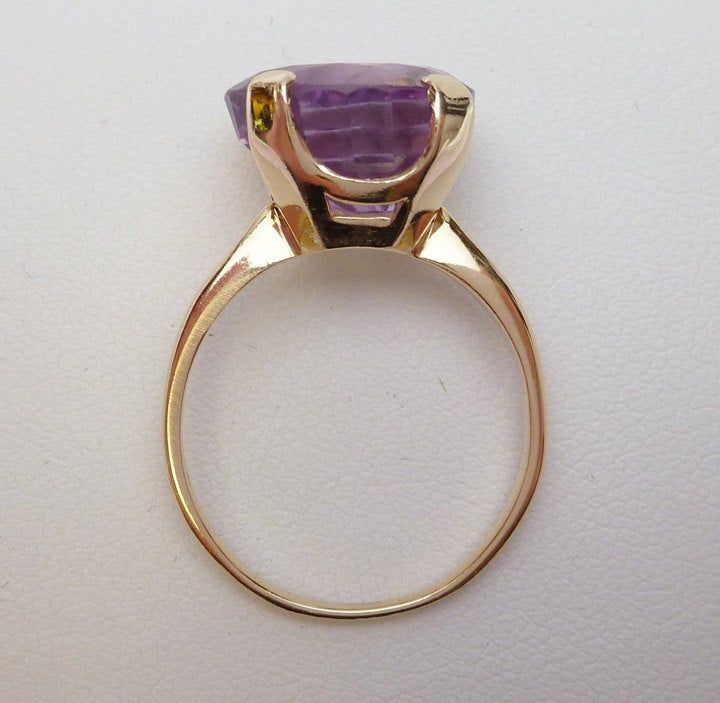 Art Deco Amethyst Ring In Yellow Gold, Yellow Gold Amethyst Ring In Art Deco Style, Art Deco Yellow Gold Amethyst Ring, Vintage Amethyst Rings With Polished Finish, Vintage Yellow Gold Amethyst Ring, Collectible Yellow Gold Amethyst Ring, Vintage Amethyst Jewelry With Polished Finish, Art Deco Amethyst Round Ring, Vintage Yellow Gold Gemstones For Anniversary