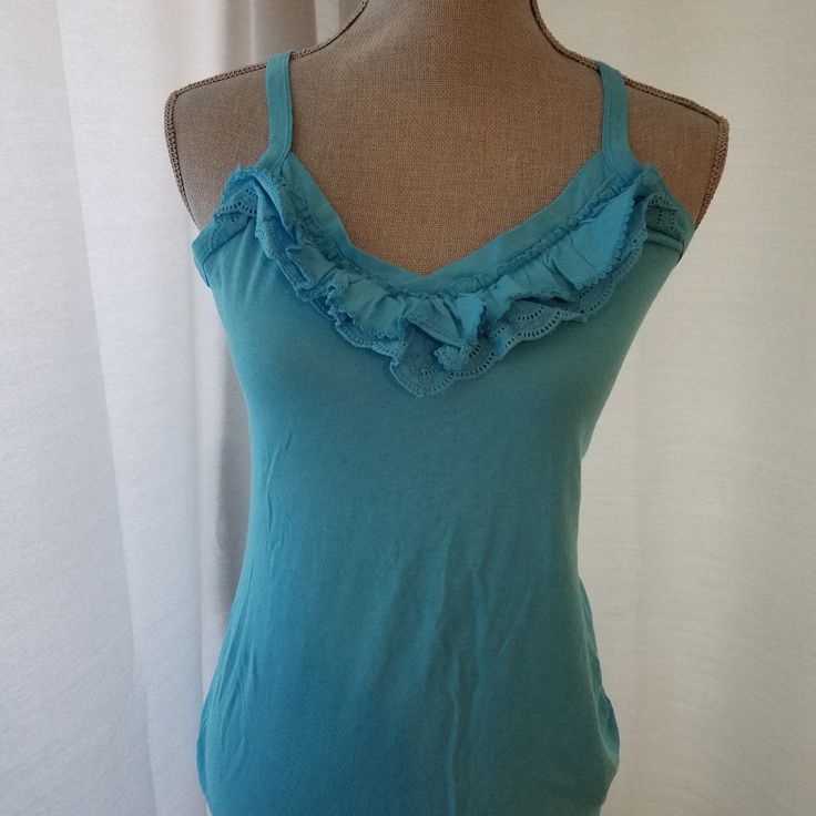 Great To Layer! Cute Ruffle Details. Blue Tops With Ruffled Straps, Layered Tank Tops 2000s, Y2k Style Sleeveless Ruffled Tops, Blue Ruffled Straps Top, Casual Blue Ruffled Tank Top, Blue Ruffled Cami Tank Top, Blue Ruffled Sleeveless Camisole, Navy Tank Top, Layering Tank Tops