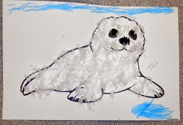 a drawing of a white seal on a piece of paper