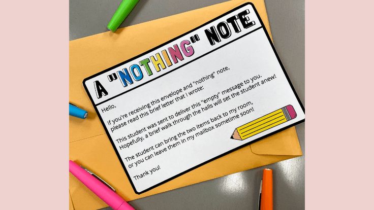 a note that has been placed on top of a piece of paper with pencils next to it