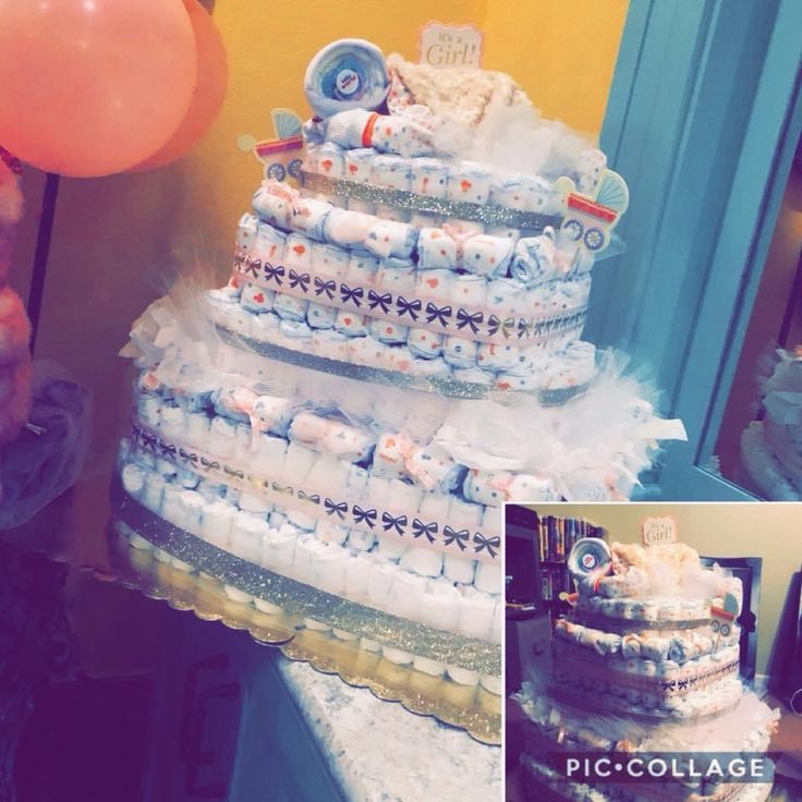 a cake made out of diapers and balloons