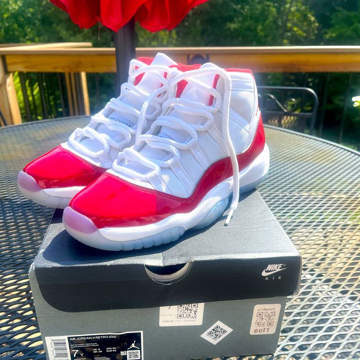 Used - Like New Air Jordan 11 Retro Cherry 7y With Box. Worn 1x Major Discount Like New! Obo ************************************************************ The Air Jordan 11 Cherry Brings A Chicago Colorway To The Iconic Patent Leather Sneaker. Cherry Red Patent Leather Mudguards Surround The Majority Of The Upper, Alongside White Leather And A Matching Cherry Red Jumpman. The Lining Features Cherry Red Cotton And With The Signature 23 Debossed On The Heel Tab. An Icy Blue Outsole And Cherry Red C Air Jordan 11 Cherry, Jordan 11 Retro Cherry, Cherry 11, Jordan 11 Cherry, Fire Shoes, Retro Cherry, Retro 11, Air Jordan 11 Retro, Cute Nike Shoes