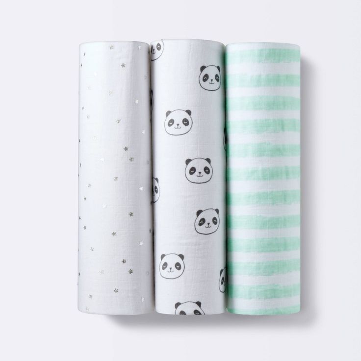 three baby swaddles with pandas on them, one in green and the other in white