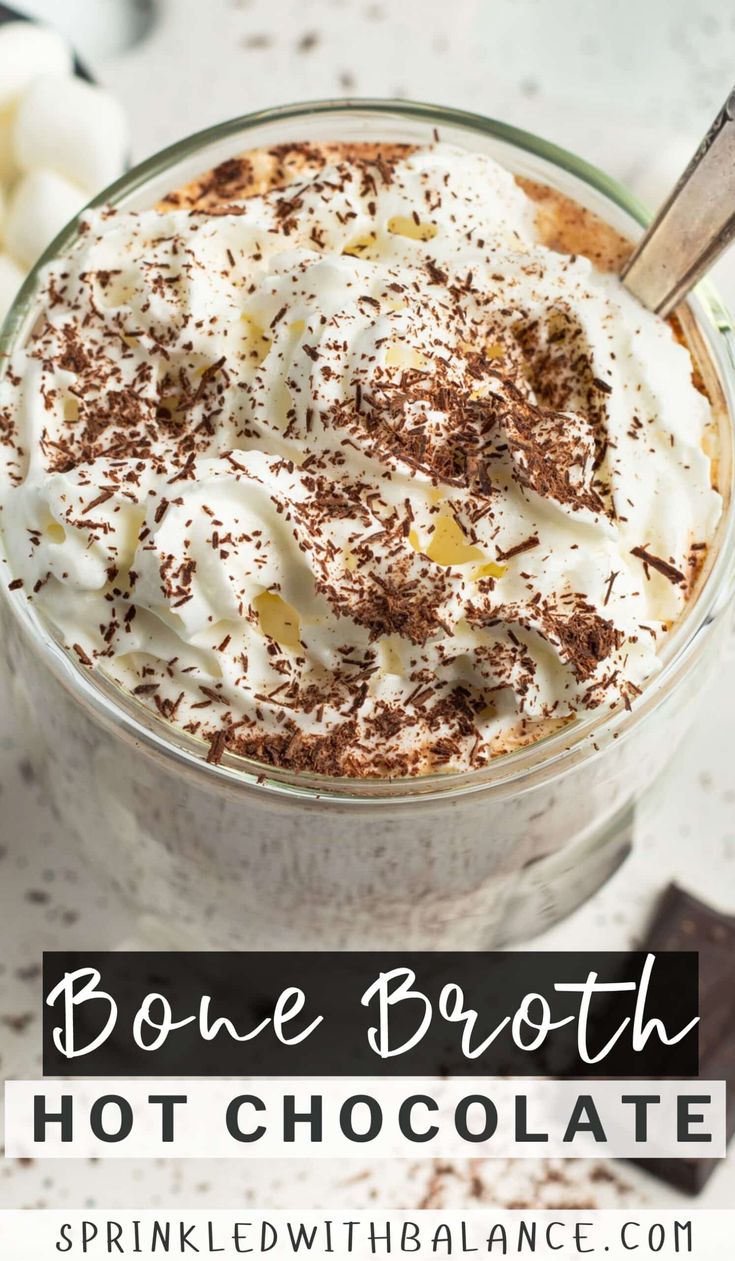 a bowl filled with hot chocolate and whipped cream