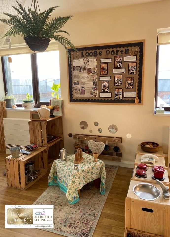 a living room filled with furniture and a potted plant on top of a table