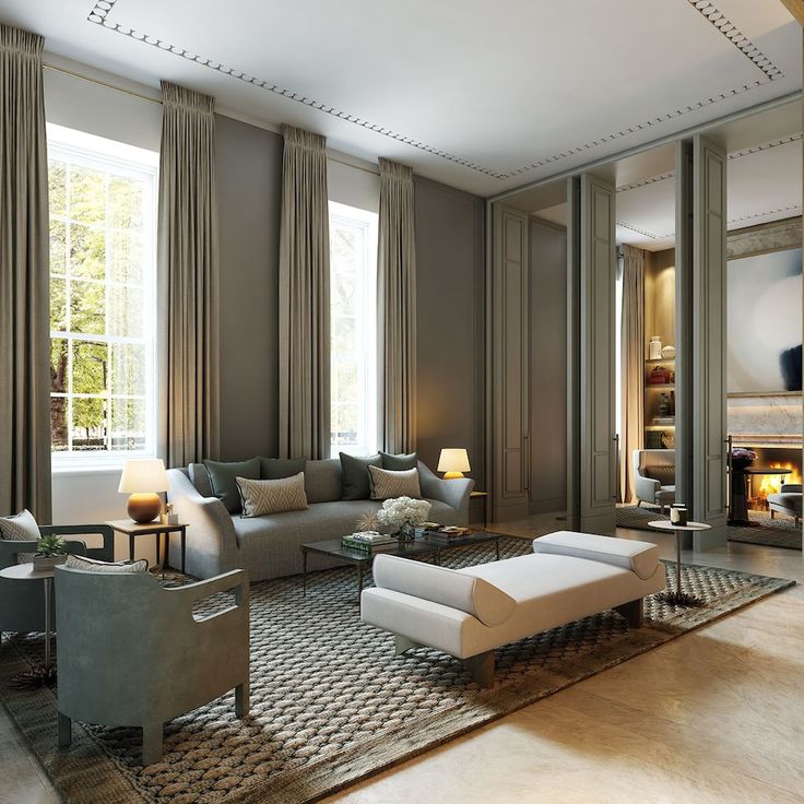 a living room filled with lots of furniture next to a fire place in a fireplace