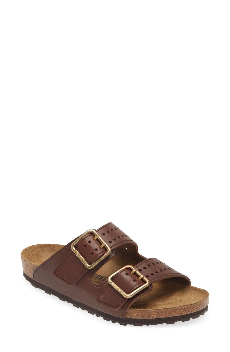 Perforations on the toe and brassy buckles give a stylish update to the classic Arizona sandal built with the same contoured footbed for comfort. Contoured footbed with arch support Leather upper and lining/synthetic sole Imported Classic Slides With Buckle Closure, Classic Brown Slip-on Footbed Sandals, Classic Sandals With Cushioned Footbed, Classic Footbed Sandals With Buckle Closure, Classic Beach Slides With Buckle Closure, Classic Slide Sandals With Cushioned Footbed, Classic Slip-on Footbed Sandals With Cork-bed Midsoles, Classic Slide Footbed Sandals With Cushioned Footbed, Classic Brown Footbed Sandals With Buckle Closure