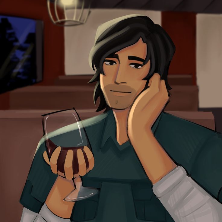 a man sitting at a table with a glass of wine in front of his face