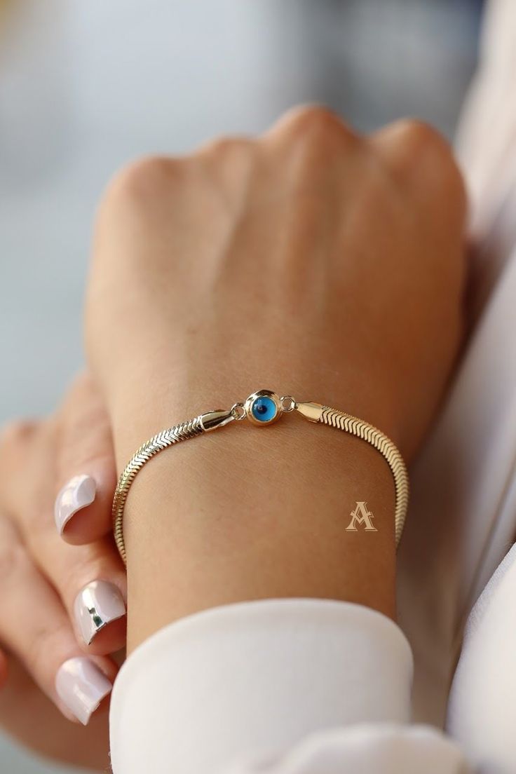 Handmade 14k Gold Evileye Bracelet for Women, Dainty 14k Gold Evileye Bracelet for Women This beautiful luxury bracelet is 14K Gold with evil eye charm on it to protect you from bad spirits if you are superstitious 😊. This is a great gold bracelet for everyday use, but also good for special occasions like weddings or birthdays. Length of bracelet is 19 cm, and its weight is 2.14 grams. Weight: 2.14 gr Length: 19 cm Since this is a handmade product there might be slight changes like its weight m Elegant 14k Gold Evil Eye Bracelet Gift, Elegant Yellow Gold Evil Eye Bracelet Gift, Elegant Round Chain Bracelet With Evil Eye, 14k Yellow Gold Evil Eye Bracelets, Luxury Yellow Gold Evil Eye Bracelet Gift, Elegant Round Evil Eye Chain Bracelet, Elegant Evil Eye Chain Bracelet Gift, Elegant Evil Eye Chain Bracelet, Elegant Beaded Evil Eye Bracelet