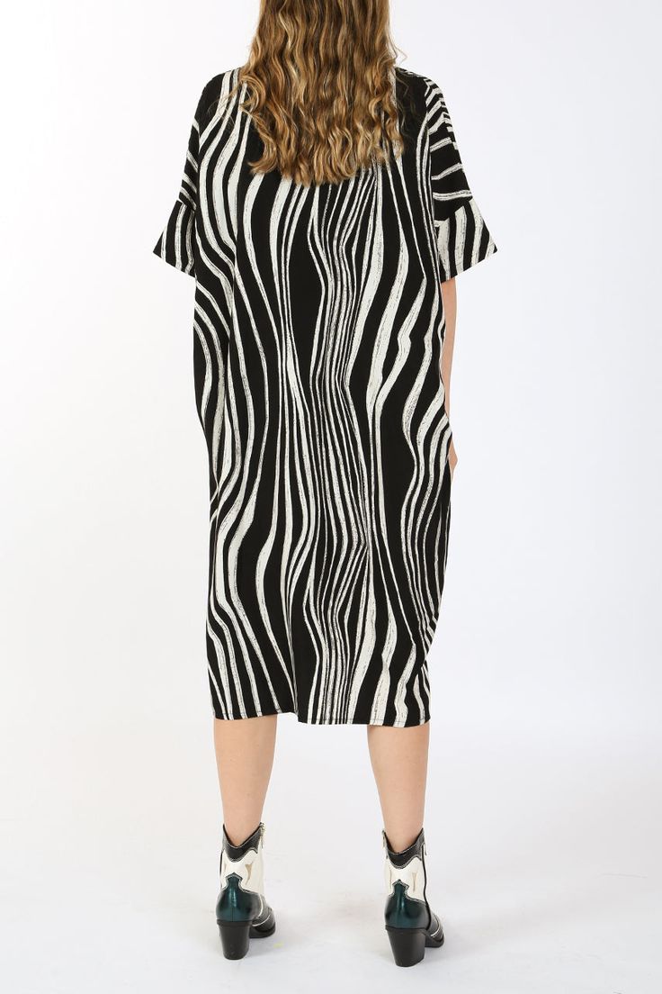 Zebra printed fabric Standard collar Button down Shirt dress Midi length Relaxed fit Imported 100% POLYESTER Model is 5 ft 10 in. Wearing a Small Caring for your clothes is caring for the environmentWash your clothes with lower temperature and delicate spin cycles. It helps to maintain the color, shape and structure of the fabric. At the same time it reduces energy consumption that is used in care processes. ONE SIZE ME3037_BLACK_ALL Black Midi Dress With Graphic Print, Oversized Striped Shirt Dress, Spring Graphic Print Workwear Dresses, Printed Short Sleeve Midi Dress For Work, Spring Graphic Print Work Dresses, Oversized Printed Black Dresses, Spring Workwear Dresses With Graphic Print, Oversized Black Printed Dress, Casual Black Zebra Print Dresses