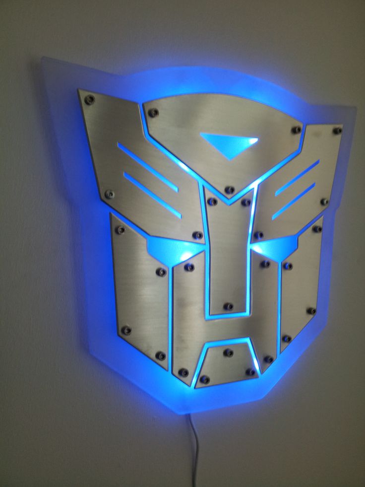 a wall mounted light with the shape of a robot head