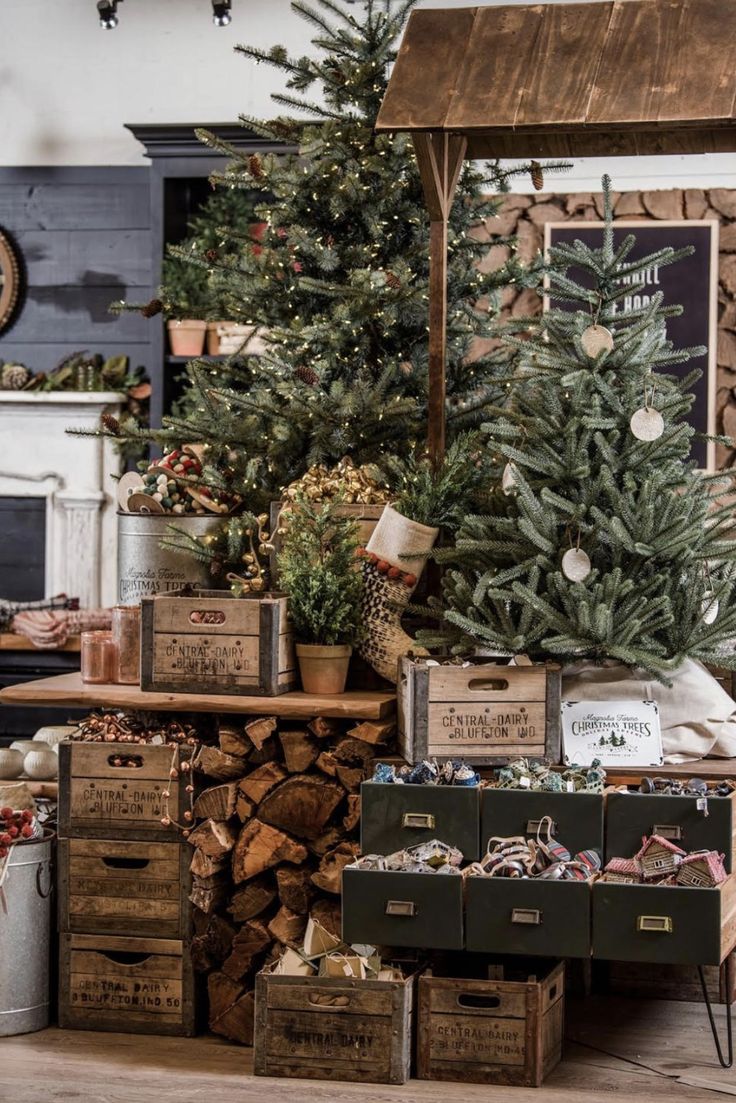 christmas trees are stacked on top of boxes