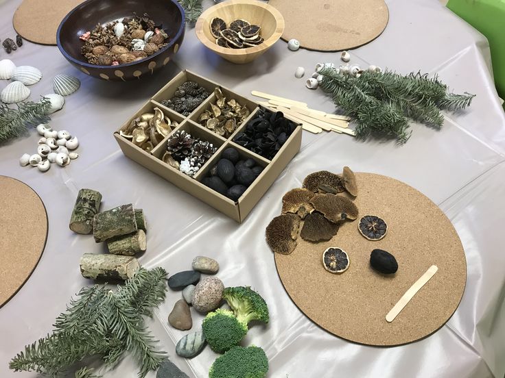 a table topped with lots of different types of rocks and veggie trays