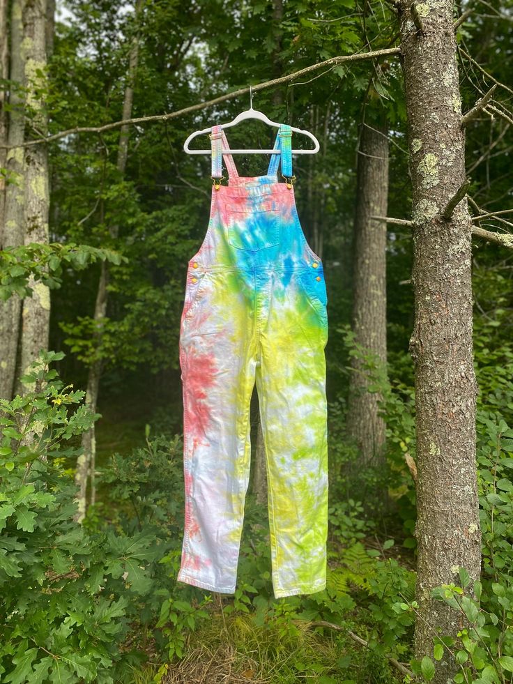 Ready to get a compliment on your outfit every time you go out? This is hand painted by me! hippie boho unique hand dyed upcycled SIZE M/L- TAG SAYS 10. THESE ARE SLIGHTLY OVERSIZED. a 12 could fit as well. advertised as "90s baggy overalls" Brand: Universal Threads model is size 4 / 6 - 140 LBS - 5'4 saving and repurposing a cool clothing item? hot stuff! Hippie Summer Overalls With Pockets, Spring Hippie Cotton Jumpsuits And Rompers, Spring Cotton Jumpsuits And Rompers, Hippie Style, Spring Cotton Jumpsuits And Rompers In Hippie Style, Hippie Multicolor Cotton Overalls, Summer Festival Cotton Overalls, Multicolor Cotton Hippie Overalls, Hippie Cotton Jumpsuits And Rompers, Multicolor Cotton Overalls For Festival