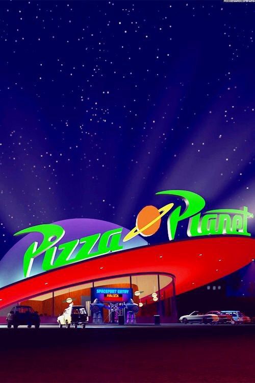 an advertisement for a pizza place at night