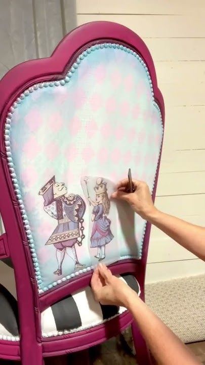 a person is drawing on a chair