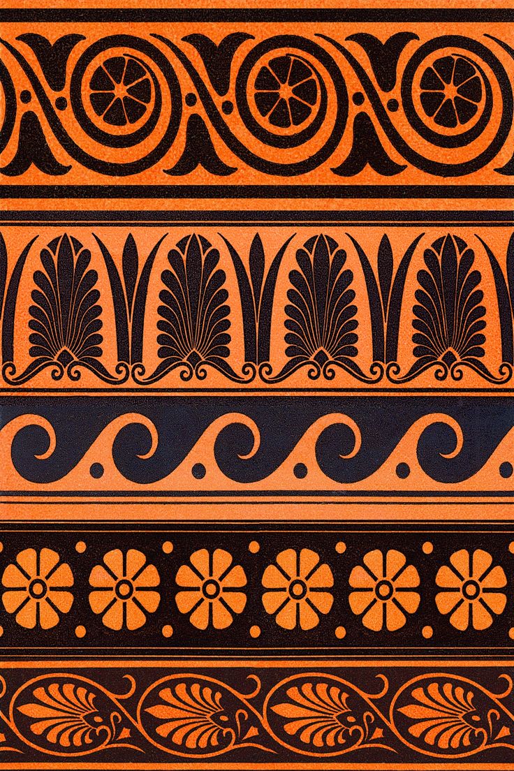 an orange and black vase with designs on it