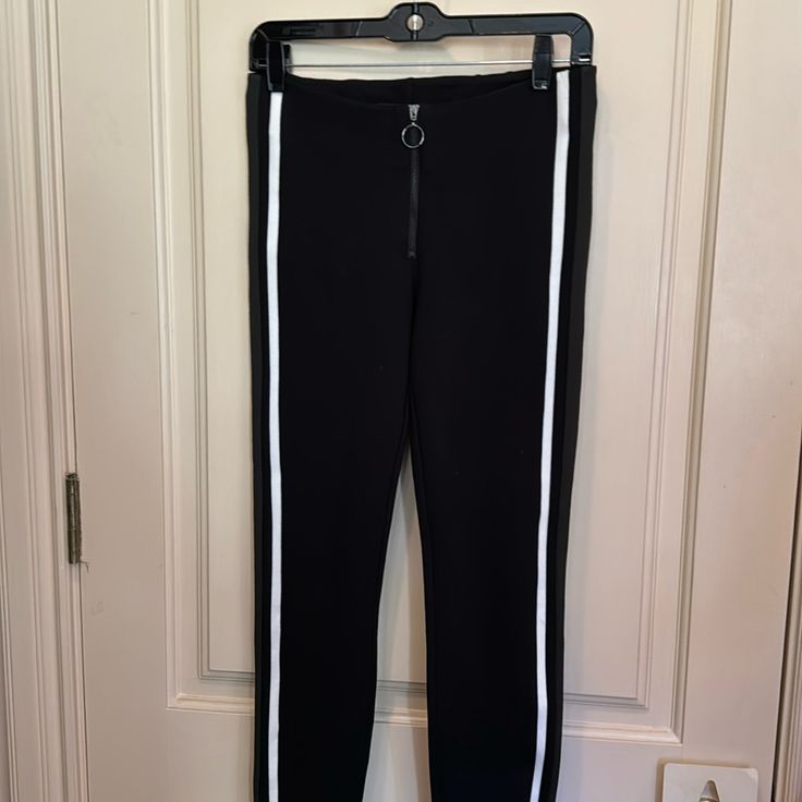 Brand New, Never Used Zara Skinny Tight Pants In Black. It Has A Strip On The Side, With Front Zipper For Perfect Fit For Your Body. Size Medium From Trafaluc Collection, Material Is Tight On Your Body For A Great Fit. Black Stretch Leggings With Zipper Closure, Trendy Black Ankle-length Leggings, Black Ankle-length Leggings For Night Out, Trendy Black Straight Leg Leggings, Black Mid-rise Pants With Zipper Closure, Chic Stretch Leggings With Zipper Closure, Sporty Fitted Bottoms With Zipper Closure, Sporty Stretch Pants With Zipper Closure, Trendy Straight Elastane Leggings