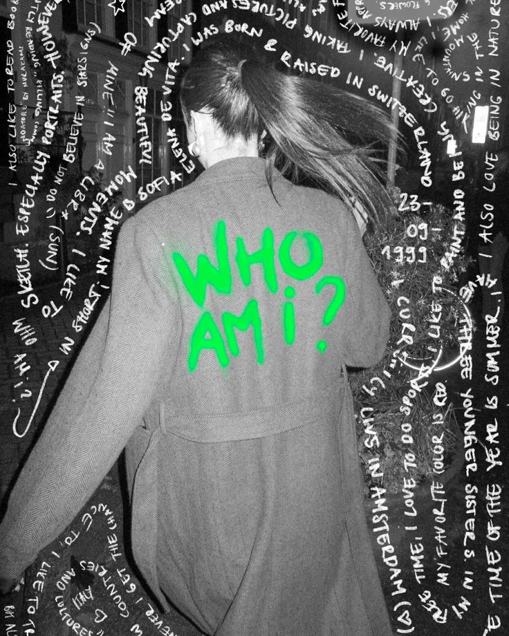 the back of a woman's shirt that says who am? in green ink