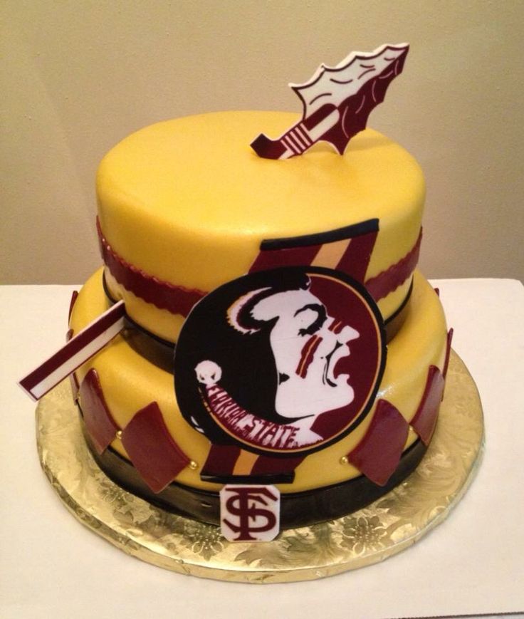 a three tiered cake is decorated with the team's logo