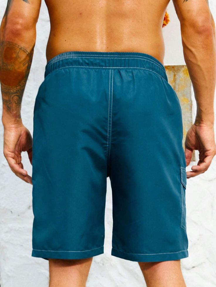 Stay organized and stylish with our Flap Pocket Swim Trunks. These swim trunks feature convenient flap pockets, providing storage for your essentials while on the beach or at the pool. The waistband offers a comfortable fit, and the quick-drying fabric ensures optimal comfort in and out of the water. Features: Color: Blue Pattern Type: Plain Details: Drawstring, Pocket Type: Bottoms Bottom Type: Shorts Fabric: Non-Stretch Care Instructions: Machine wash, do not dry clean Body: Lined Sheer: No Si Summer Nylon Swim Trunks With Side Pockets, Outdoor Bottoms With Pockets For Beach Season, Summer Sports Shorts With Cargo Pockets, Short Swim Trunks With Pockets For Beach Season, Beach Bottoms With Side Pockets In Nylon, Summer Nylon Shorts With Multiple Pockets, Nylon Beach Bottoms With Side Pockets, Casual Swimwear With Side Pockets For Beach Season, Casual Swimwear With Side Pockets For Beach