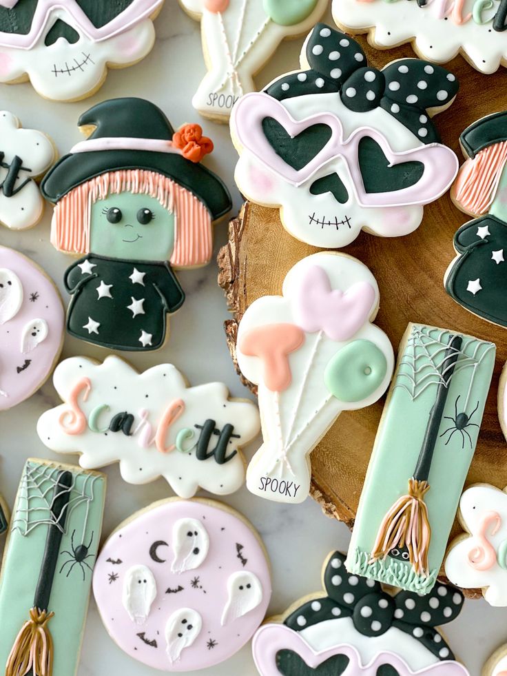 some decorated cookies are laying on a table