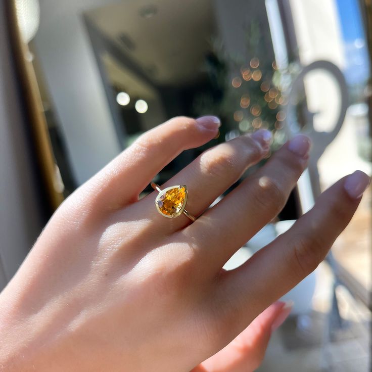 14K Yellow Gold Pear Shape Citrine Light Orange Enamel Halo 1.59 Total Citrine Carat Weight Solitaire Band Stock Size: 7 Pear Shape Ring, Solitaire Bands, Halo 1, Gemstone Earrings Dangle, Pear Shaped Ring, Jewelry Appraisal, Mens Chain Necklace, Star Jewelry, Enamel Ring