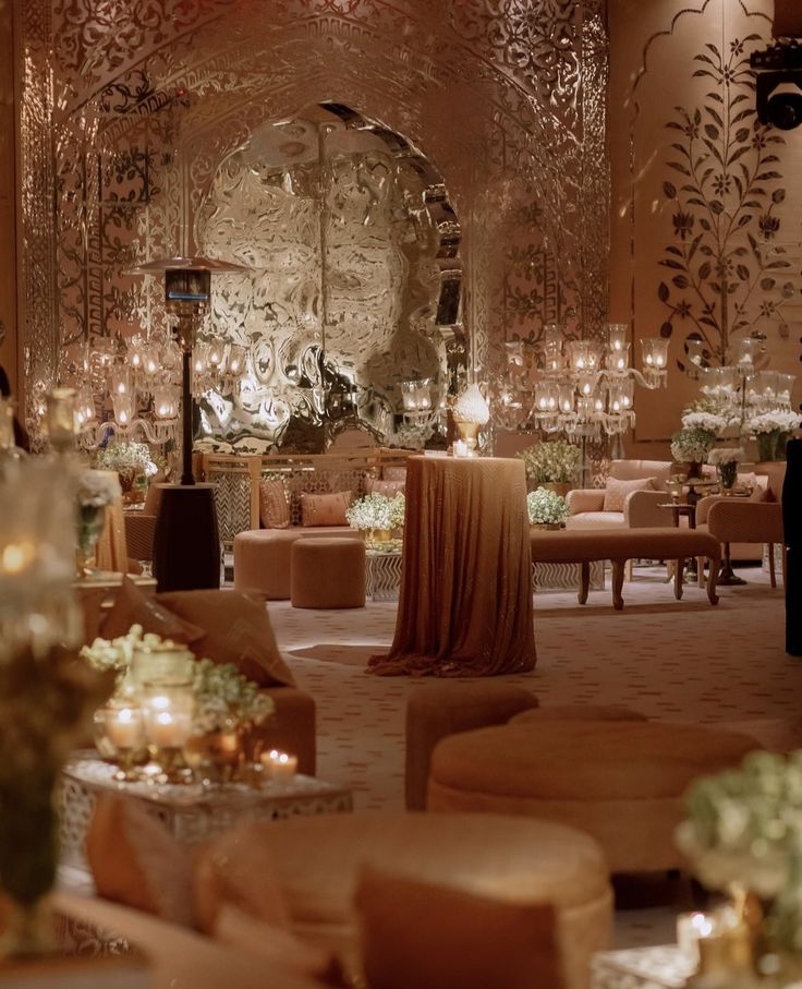 an elaborately decorated ballroom with chandeliers and tables set up for a formal function