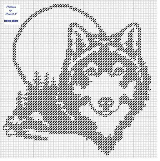 a cross stitch pattern with the head of a wolf on it's face, in black and white