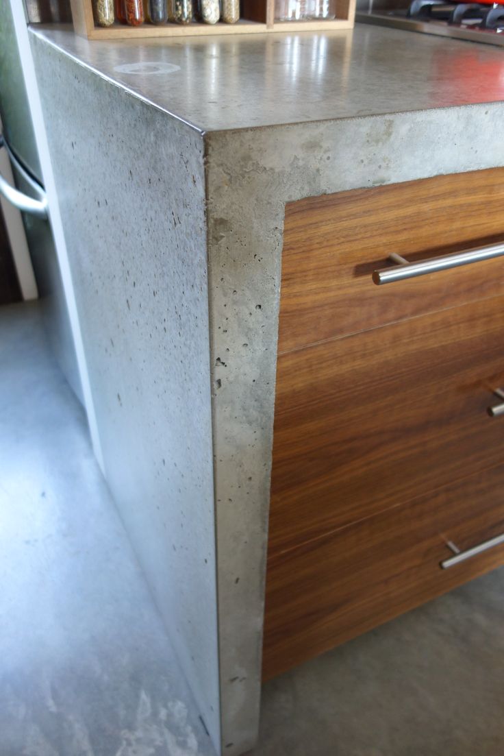 a kitchen counter with two drawers on it