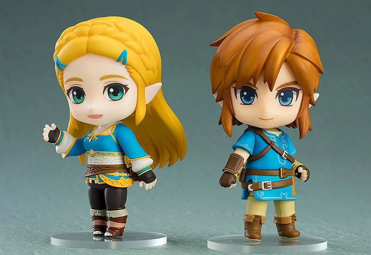 two figurines of the legend of zelda and link from breath of time