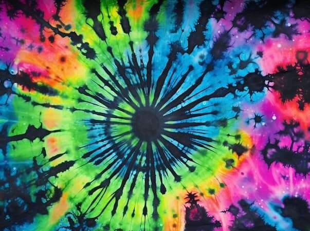 a colorful tie - dyed background with lots of colors