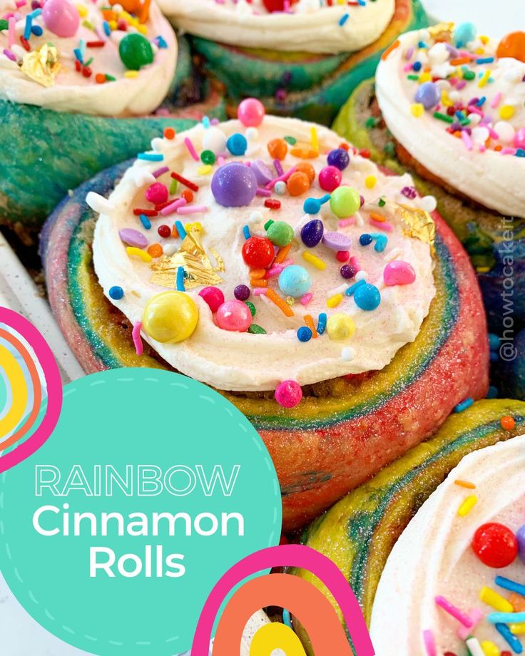 rainbow cinnamon rolls with white frosting and sprinkles