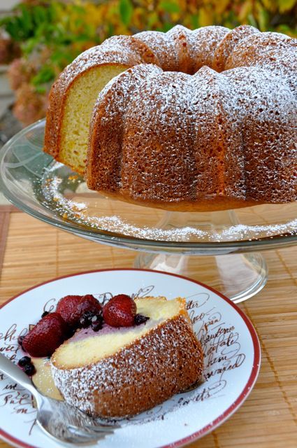 two plates with cakes on them sitting next to each other