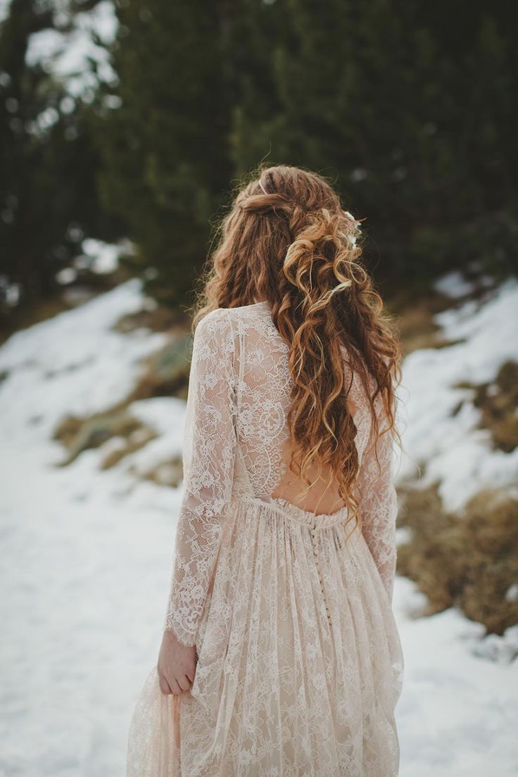 the back of a woman's dress in the snow