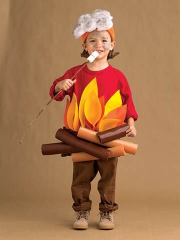 a young boy dressed up as a campfire with marshmallows