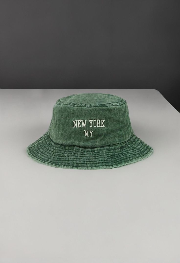 Introducing the NEW YORK 3D Pigment Bucket Hat - a classic and stylish accessory designed to elevate your look while protecting you from the sun's harmful rays. Made with high-quality materials and featuring a bold 3D pigment logo, this hat will give you the perfect mix of fashion and function. Whether you're strolling through the city or relaxing on a sunny beach, the NEW YORK 3D Pigment Bucket Hat is a must-have for any fashion-forward individual. Green Bucket Hat With Visor For Outdoor, Trendy Green Sun Hat For Outdoors, Trendy Green Sun Hat For Outdoor, Green Visor Bucket Hat For Outdoor, Green Short Brim Hat With Uv Protection, Green Wide Brim Bucket Hat Casual Style, Green Visor Bucket Hat For Summer, Green Casual Bucket Hat With Short Brim, Casual Green Bucket Hat With Short Brim