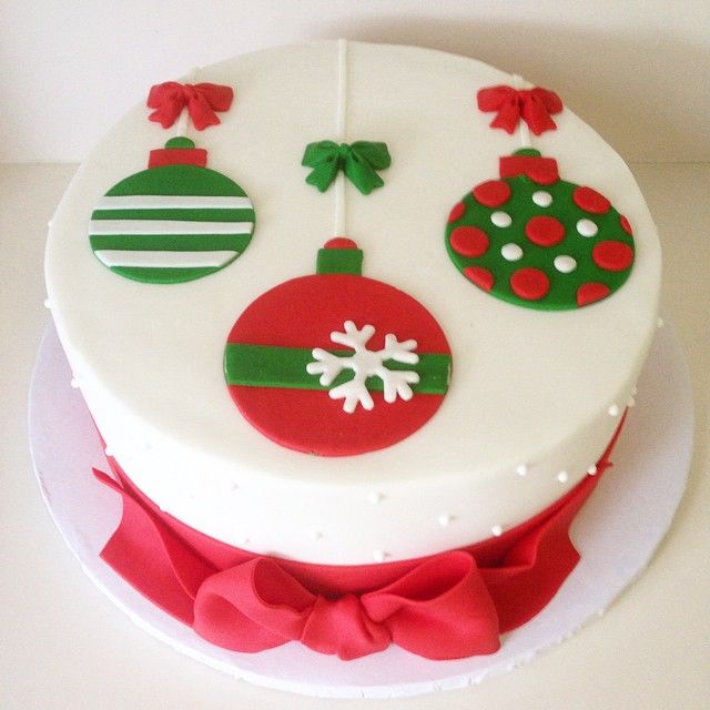 a white cake with red and green decorations