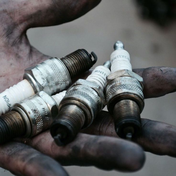 two hands holding several different types of hoses in their palm, and one hand is holding the other