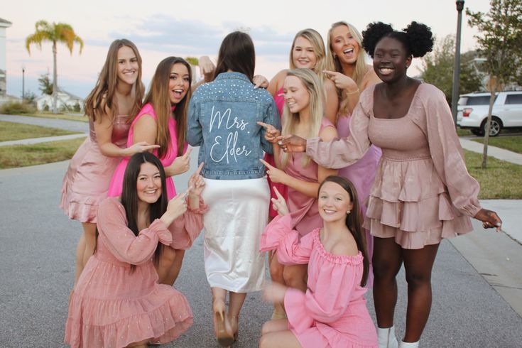 a group of young women standing next to each other