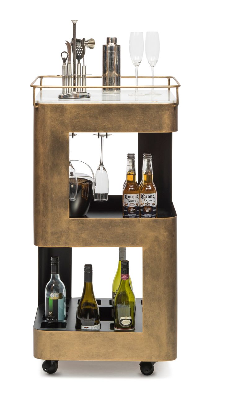 a gold bar cart with bottles and glasses on the top, two shelves holding drinks