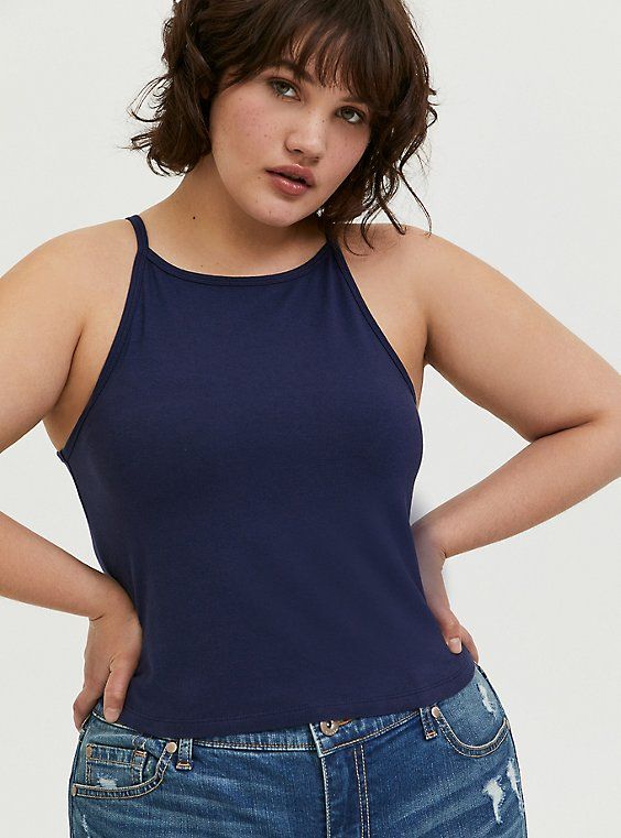 You'll love the versatility and flattering fit of a Foxy crop top that's thick with just the right amount of stretch. Foxy fabric. High neck. Racerback. Sleeveless; fixed straps. Cropped. CONTENT + CARECotton/spandex. Wash cold; dry low. Imported plus size tops. SIZE + FITModel is 5'8”, size 1. Size 2 measures 21” from shoulder. The best plus size women's foxy high neck crop top sleeveless & tank tops in peacoat made of foxy. Rock your look from Torrid to Festivals like Coachella and Lollapalooz Stretch Cropped Tank Top With Adjustable Straps, Workout Cropped Tops With Adjustable Straps, Summer Workout Crop Top With Spaghetti Straps, Summer Adjustable Straps Racerback Crop Top, Summer Crop Top With Adjustable Racerback Straps, Summer Racerback Crop Top With Adjustable Straps, Black Cold Shoulder Top, High Neck Crop Top, Black Peplum