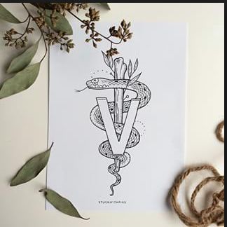 the letter v is surrounded by flowers and leaves