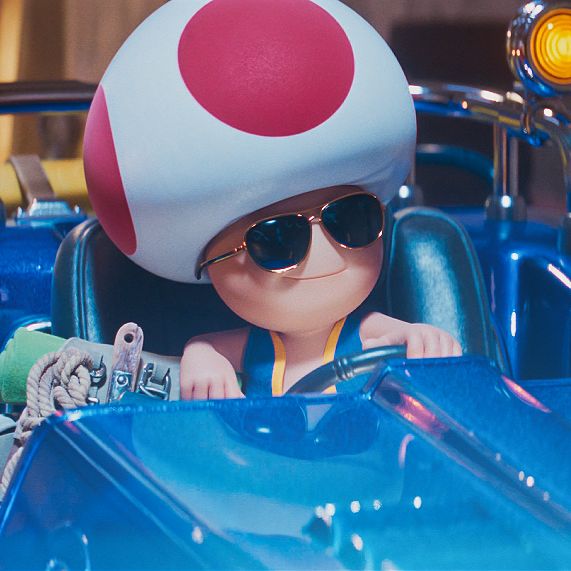 a close up of a toy car with a mushroom on the top and sun glasses