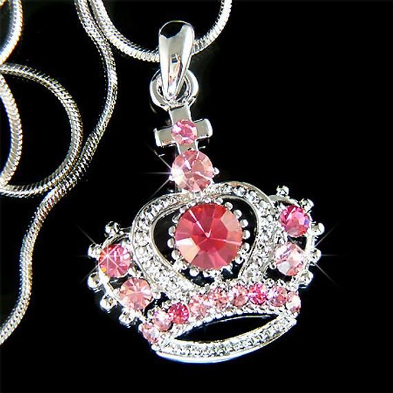 "PERFECT CHRISTMAS GIFT FOR LADIES You are getting a Princess / Queen Crown & Cross Pendant with Swarovski crystals. It comes with a FREE 18\" inches silver Plated Snake Chain necklace with lobster clasp. Crown with Cross size is 1\" (2.5cm) X 1\"(2.5cm) Crystal Color: LIGHT ROSE + ROSE Prices are in US$. For shipping policies and other important information, click on \"profile\" on the right. See an item that you like but has already been sold? Contact me to see if I have more! Thank you fo Pink Crystal Jewelry For Mother's Day, Pink Rhinestone Necklace With Bling For Gift, Pink Rhinestone Bling Necklace For Gift, Pink Rhinestone Bling Necklace Gift, Silver Rhinestone Necklace For Wedding On Valentine's Day, Pink Crystal Necklaces For Mother's Day, Pink Crystal Necklace For Mother's Day, Mother's Day Pink Crystal Necklace, Pink Bling Necklace For Gift