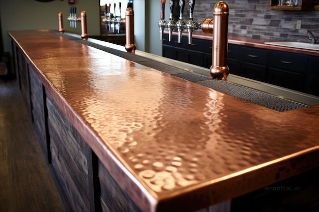 a bar with copper colored counter tops in a restaurant