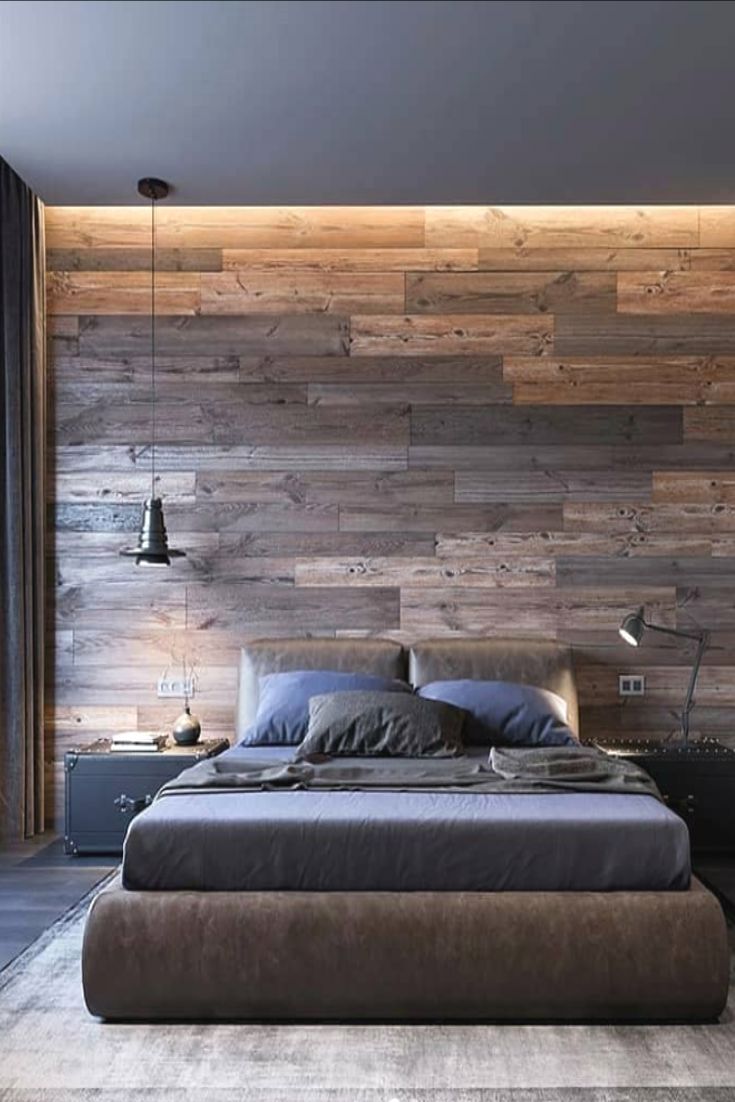 a bedroom with wood paneling on the wall