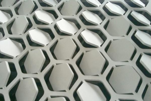 close up view of metal hexagonals on the floor in an office building