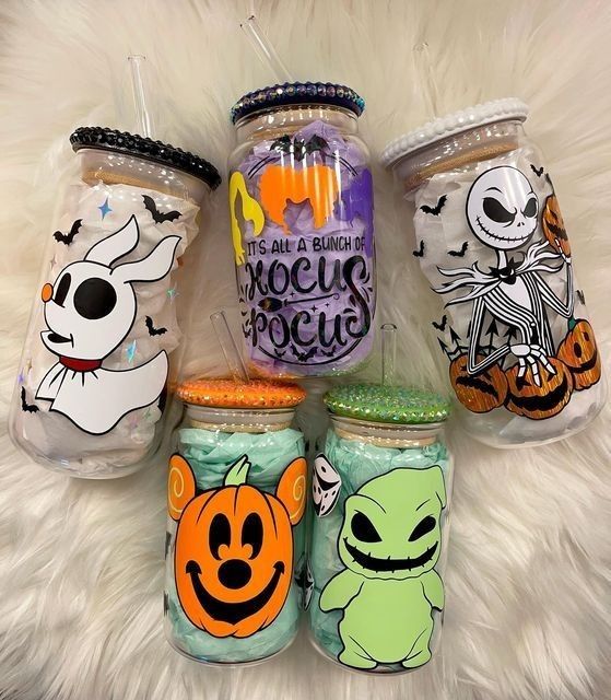 there are many halloween mason jars on the fur