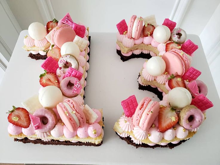 the letter e is made up of donuts, strawberries and other toppings